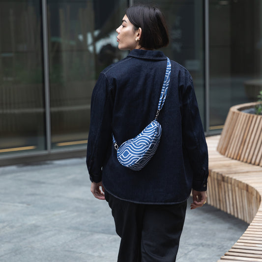 Lifestyle image for Reversible Print Backpack - Blue Wave